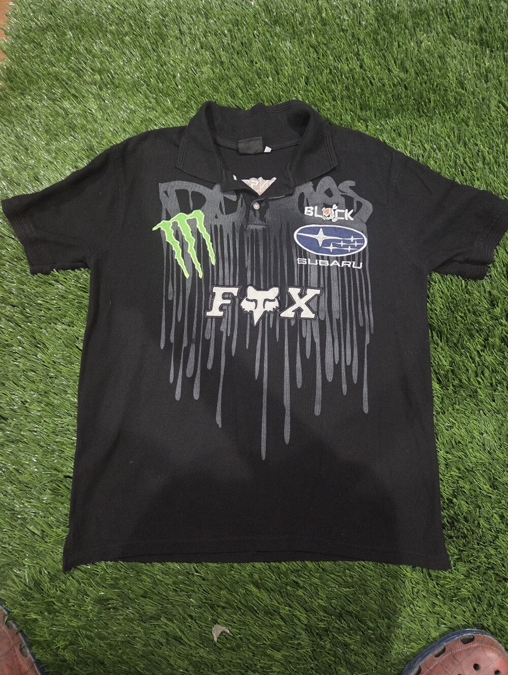 Fox Black Polo with Neon Green Monster Tag